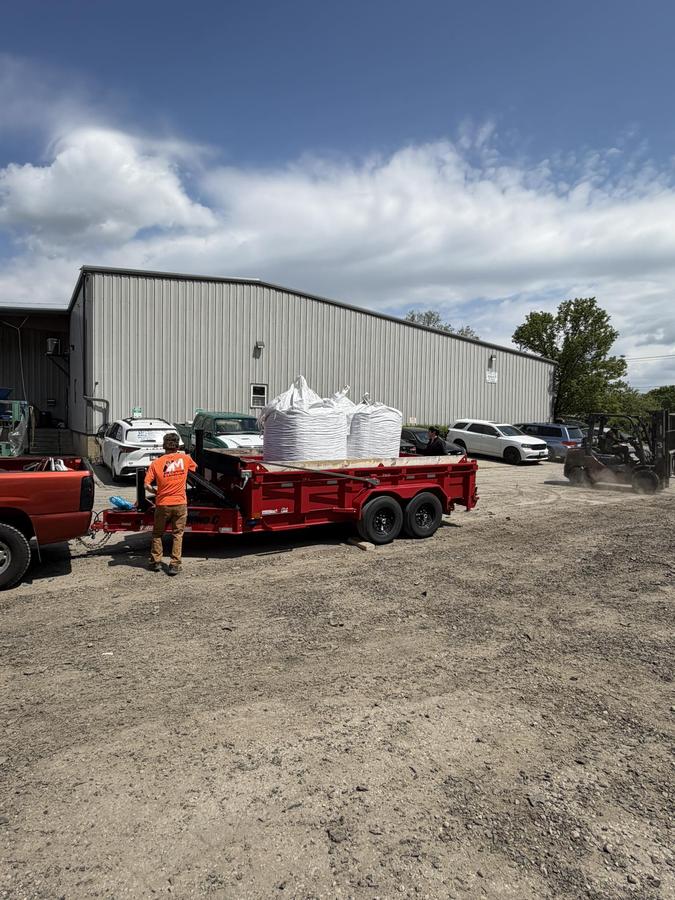 A&M Curbing & Landscape equipment ready for decorative concrete border installation.